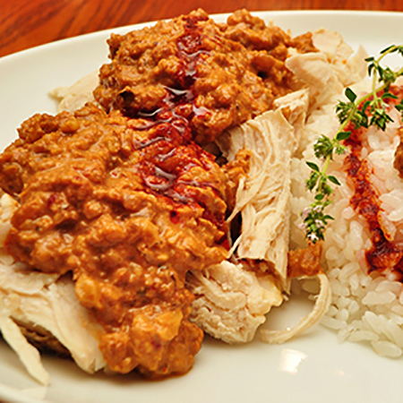 image of sharkasayya, a boiled chicken dish with garlic walnut sauce